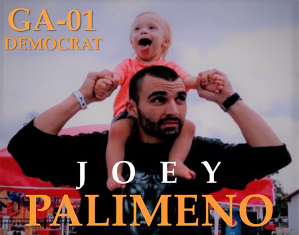 Joey at a rally with his soon smiling sitting on his shoulders and Joey holding his hands